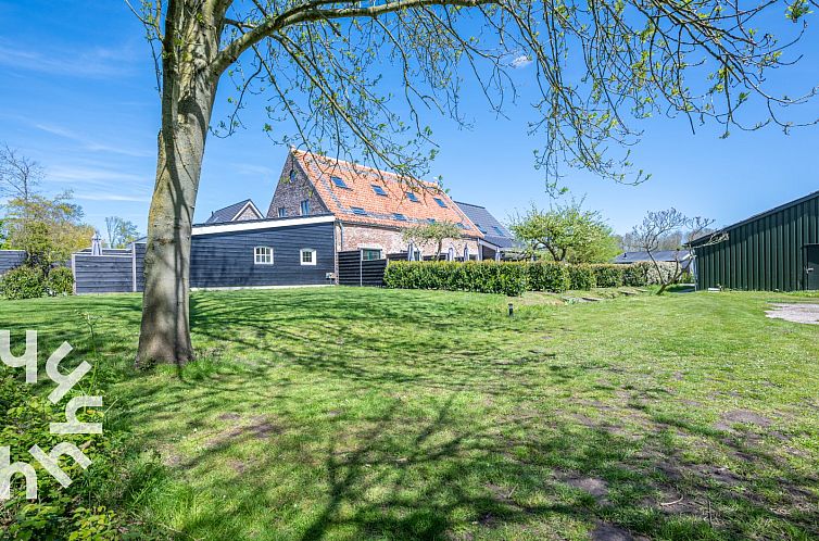 4-persoons woning met whirpool ligbad en tuin op het zuiden